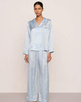 Model is wearing Inez Washable Silk Printed Long PJ Set in Large Swans Powder Blue/Ivory