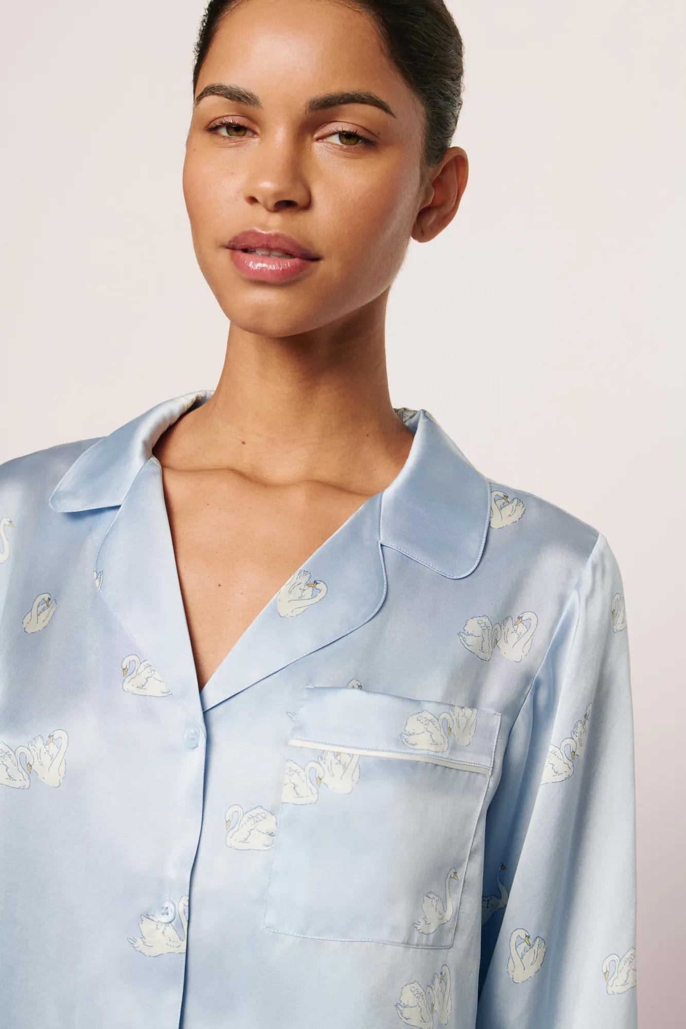 Model is wearing Inez Washable Silk Printed Long PJ Set in Large Swans Powder Blue/Ivory