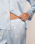 Model is wearing Inez Washable Silk Printed Long PJ Set in Large Swans Powder Blue/Ivory