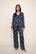 Model is wearing Inez Washable Silk Printed Long PJ Set in Moonlight Navy/Ivory