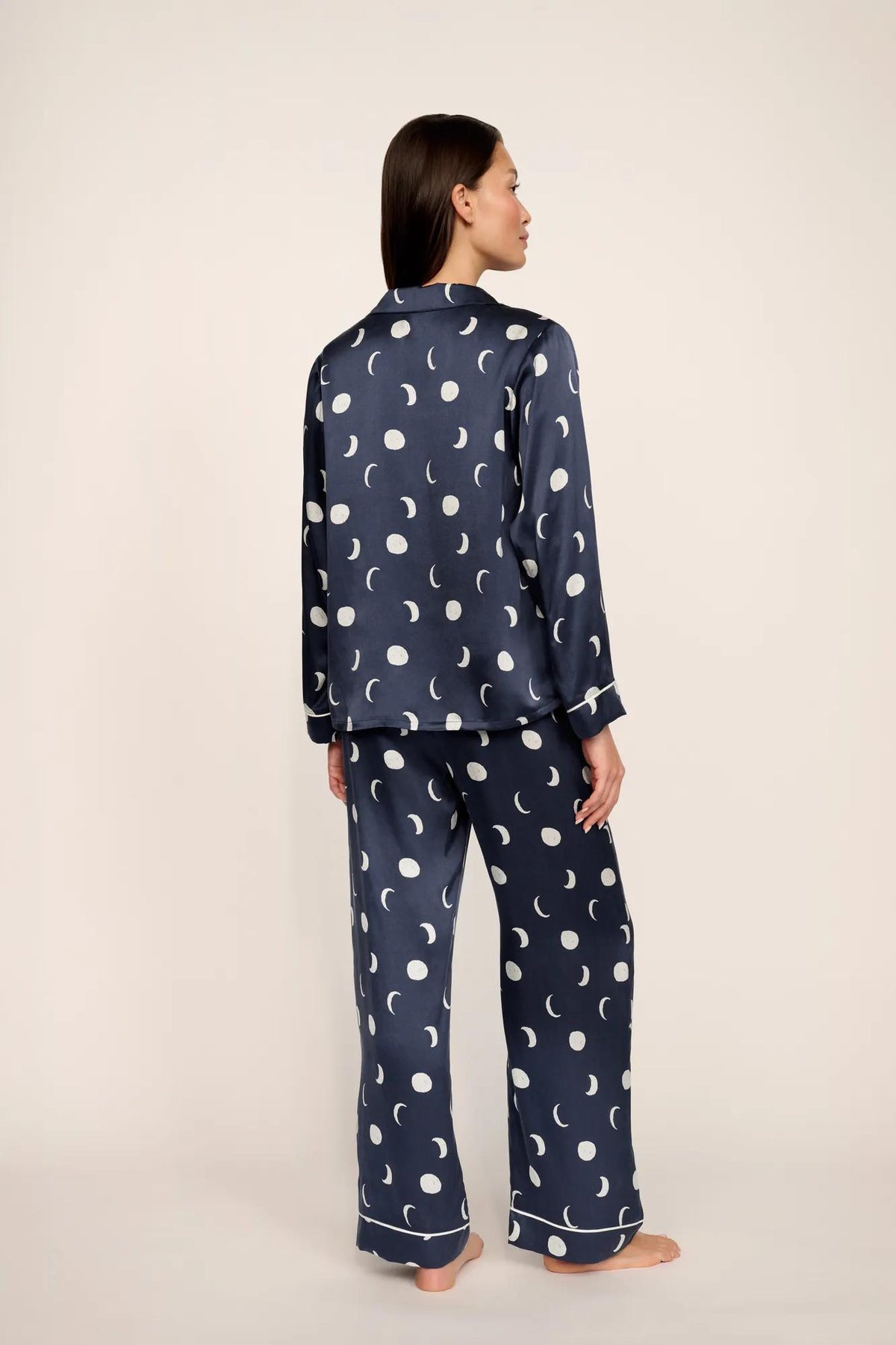 Model is wearing Inez Washable Silk Printed Long PJ Set in Moonlight Navy/Ivory