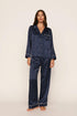Model is wearing Inez Washable Silk Printed Long PJ Set in Santa Paws Navy/Ivory