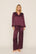 Model is wearing Inez Washable Silk Printed Long PJ Set in Starlight Wildberry/Wildberry