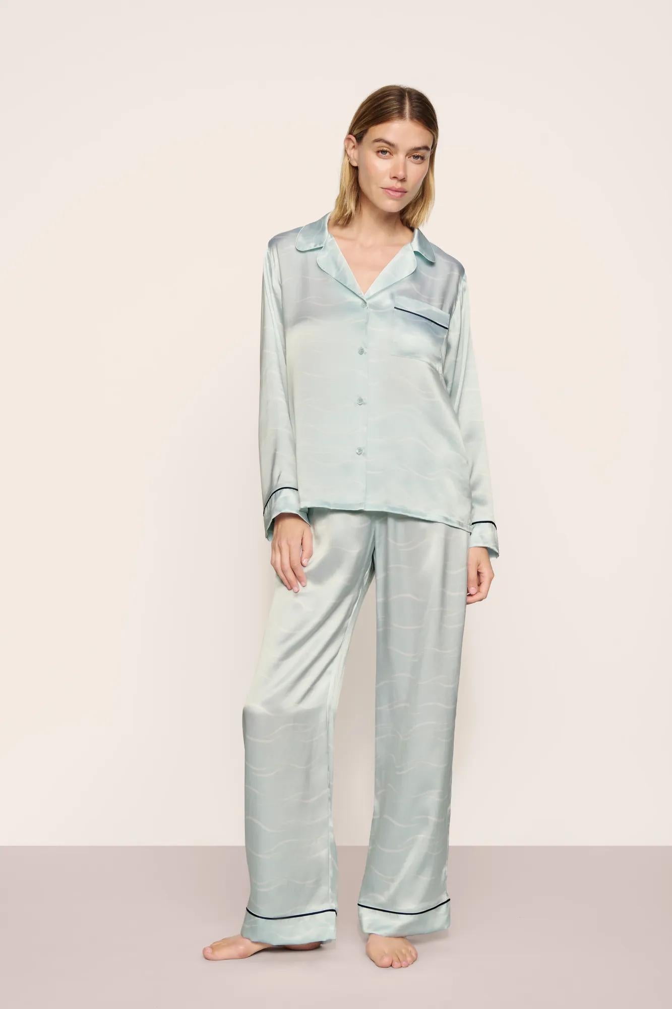 Model is wearing Inez Washable Silk Printed Long PJ Set in Waves Memorable Blue/Navy