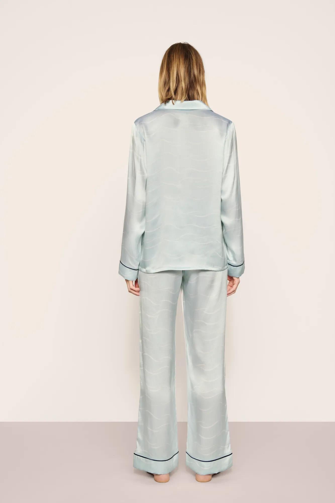 Model is wearing Inez Washable Silk Printed Long PJ Set in Waves Memorable Blue/Navy