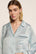 Model is wearing Inez Washable Silk Printed Long PJ Set in Waves Memorable Blue/Navy