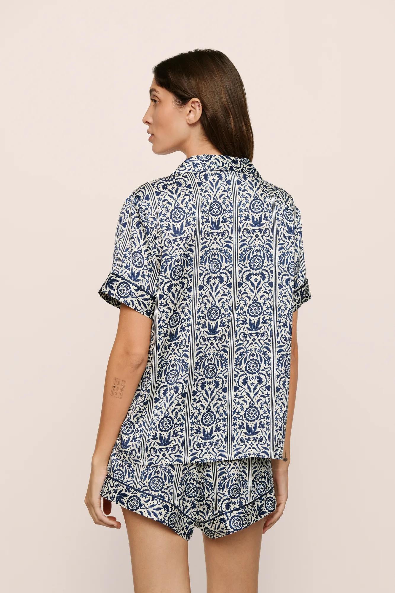 Model is wearing Inez Washable Silk Printed Short PJ Set in  Azulejos Navy/Navy