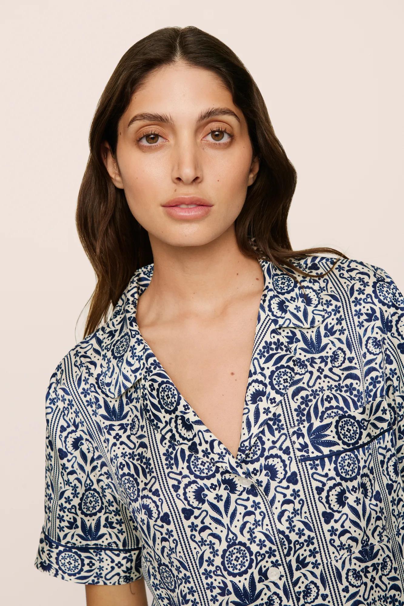 Model is wearing Inez Washable Silk Printed Short PJ Set in  Azulejos Navy/Navy