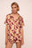 Model is wearing Inez Washable Silk Printed Short PJ Set in Botanical Flower Merlot/Merlot