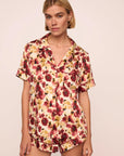 Model is wearing Inez Washable Silk Printed Short PJ Set in Botanical Flower Merlot/Merlot