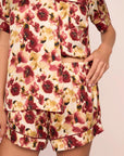 Model is wearing Inez Washable Silk Printed Short PJ Set in Botanical Flower Merlot/Merlot