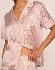 Model is wearing Inez Washable Silk Printed Short PJ Set  in Geosphere Silver Pink/Silverpi