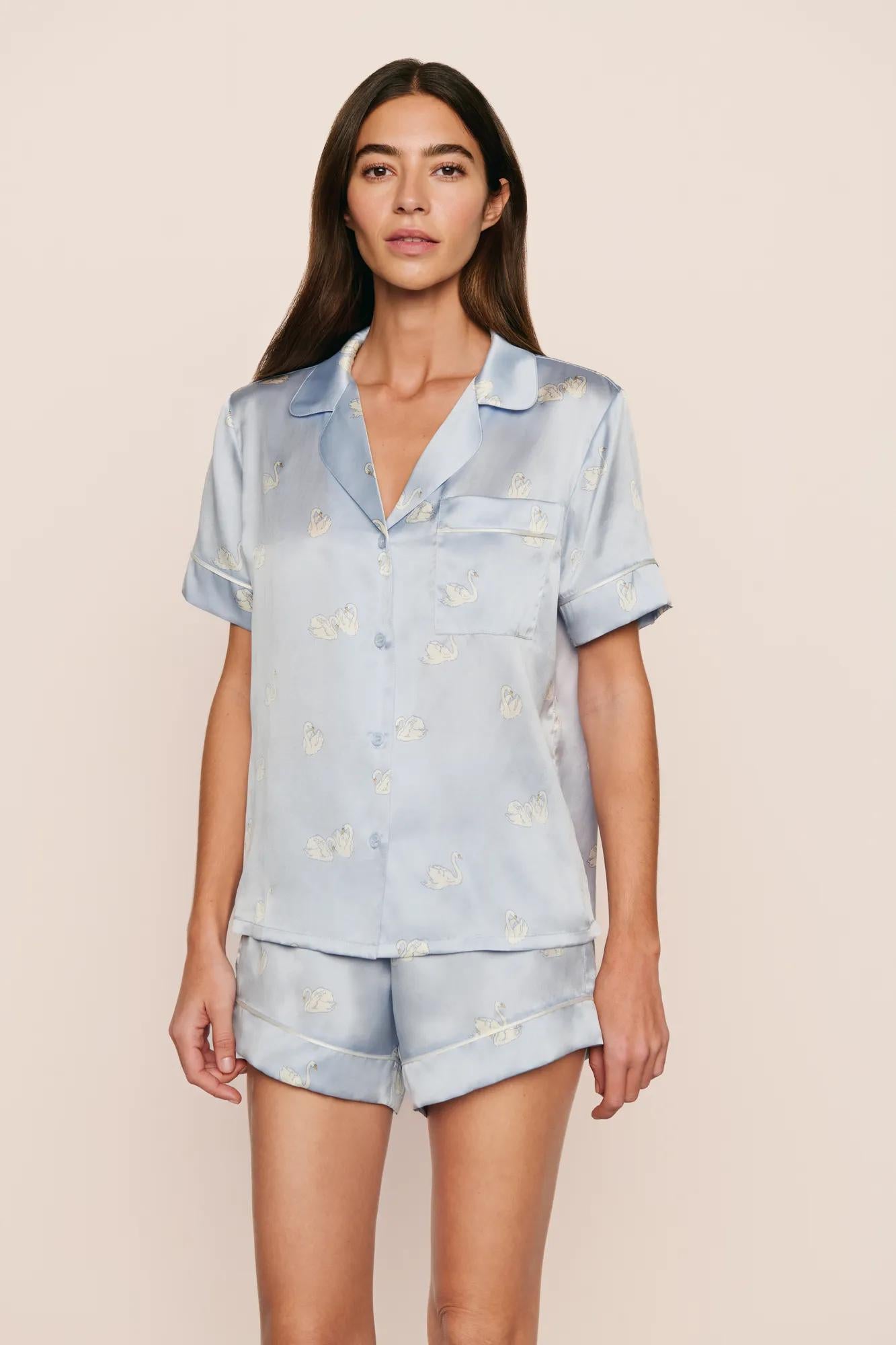 Model is wearing Inez Washable Silk Printed Short PJ Set in Large Swans Powder Blue/Ivory
