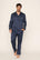 Model is wearing Charles Washable Silk Printed Long PJ Set in Santa Paws Navy/Ivory