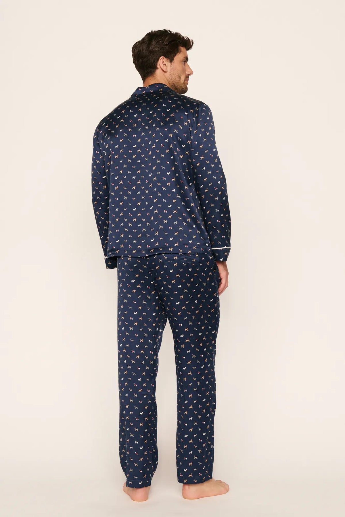 Model is wearing Charles Washable Silk Printed Long PJ Set in Santa Paws Navy/Ivory