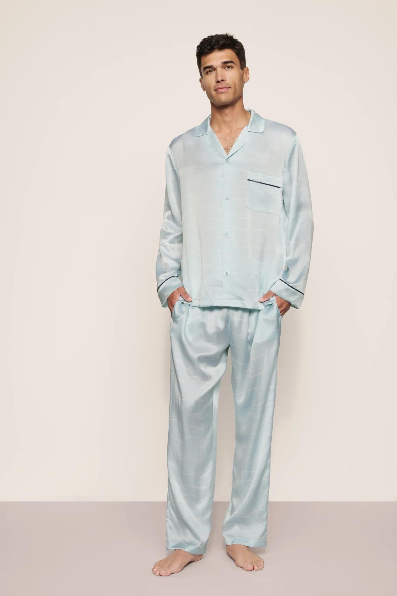 Model is wearing Charles Washable Silk Printed Long PJ Set in Waves Memorable Blue/Navy
