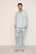 Model is wearing Charles Washable Silk Printed Long PJ Set in Waves Memorable Blue/Navy