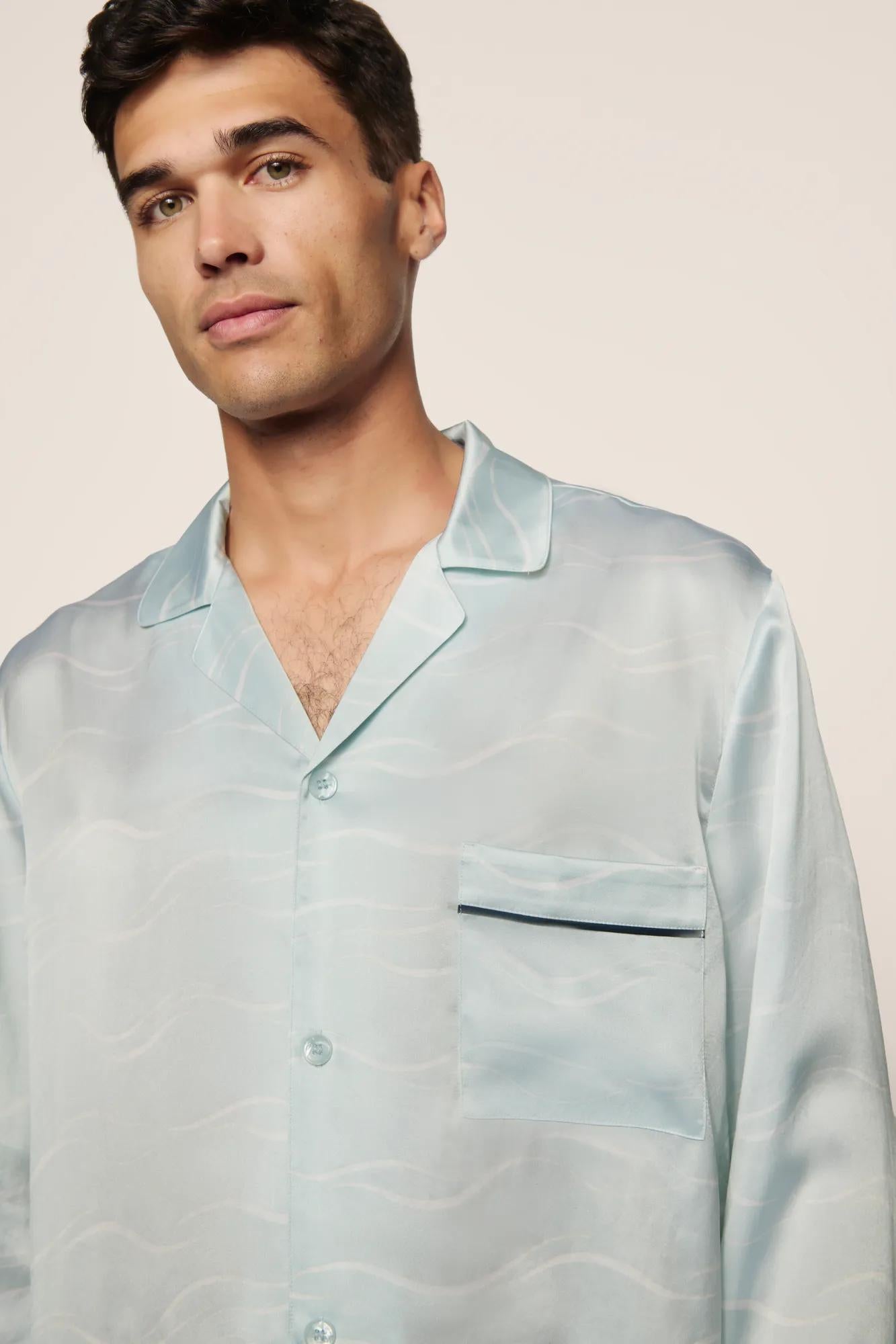 Model is wearing Charles Washable Silk Printed Long PJ Set in Waves Memorable Blue/Navy