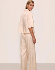 Model is wearing Inez Washable Silk Jacquard Relaxed Wide Leg Pant PJ Set in  Floral Vine Peach Dust