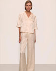 Model is wearing Inez Washable Silk Jacquard Relaxed Wide Leg Pant PJ Set in  Floral Vine Peach Dust