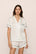 Model is wearing Inez Washable Silk Jacquard Short PJ Set in ClassicStripeJacquardPea/Na