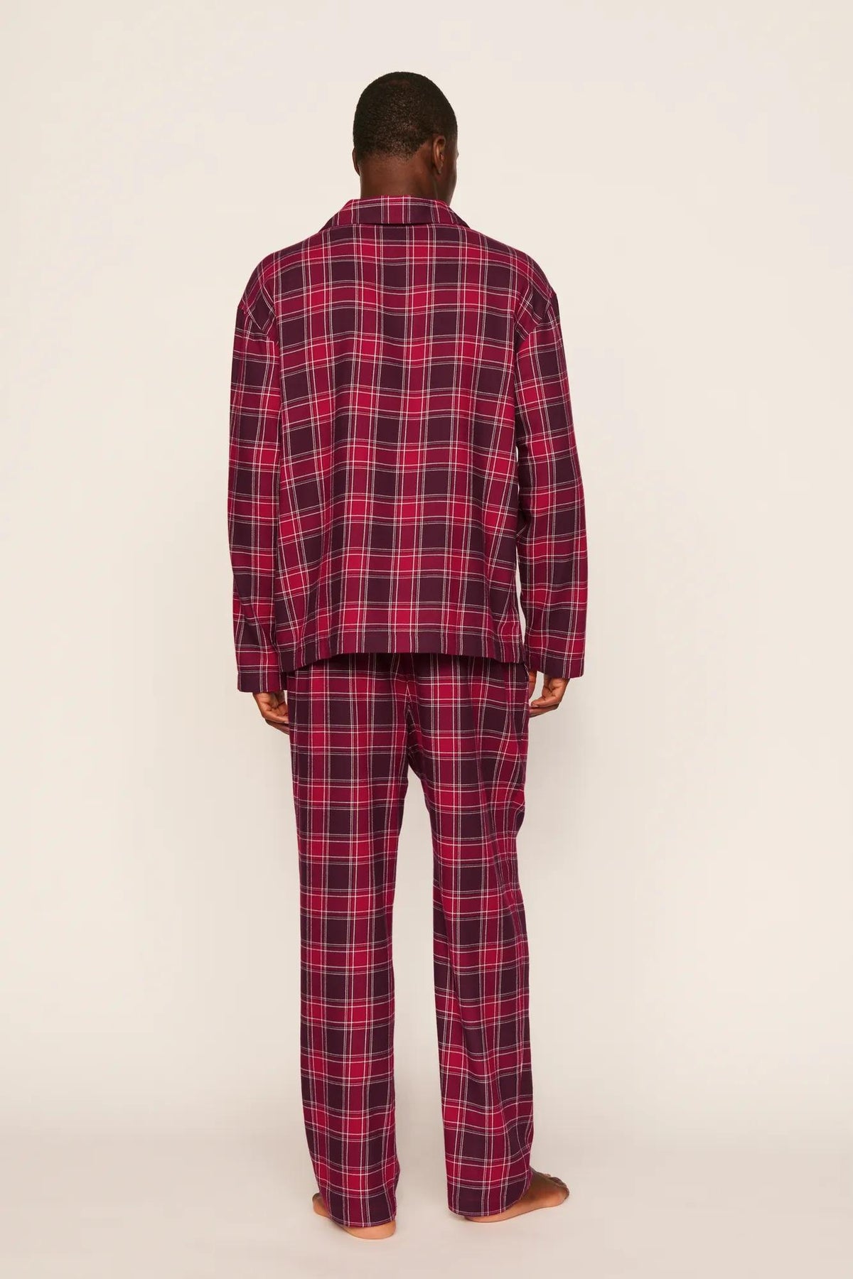 Model is wearing Flannel Men's Long PJ Set in Oxford Check Holly Red/Wildber