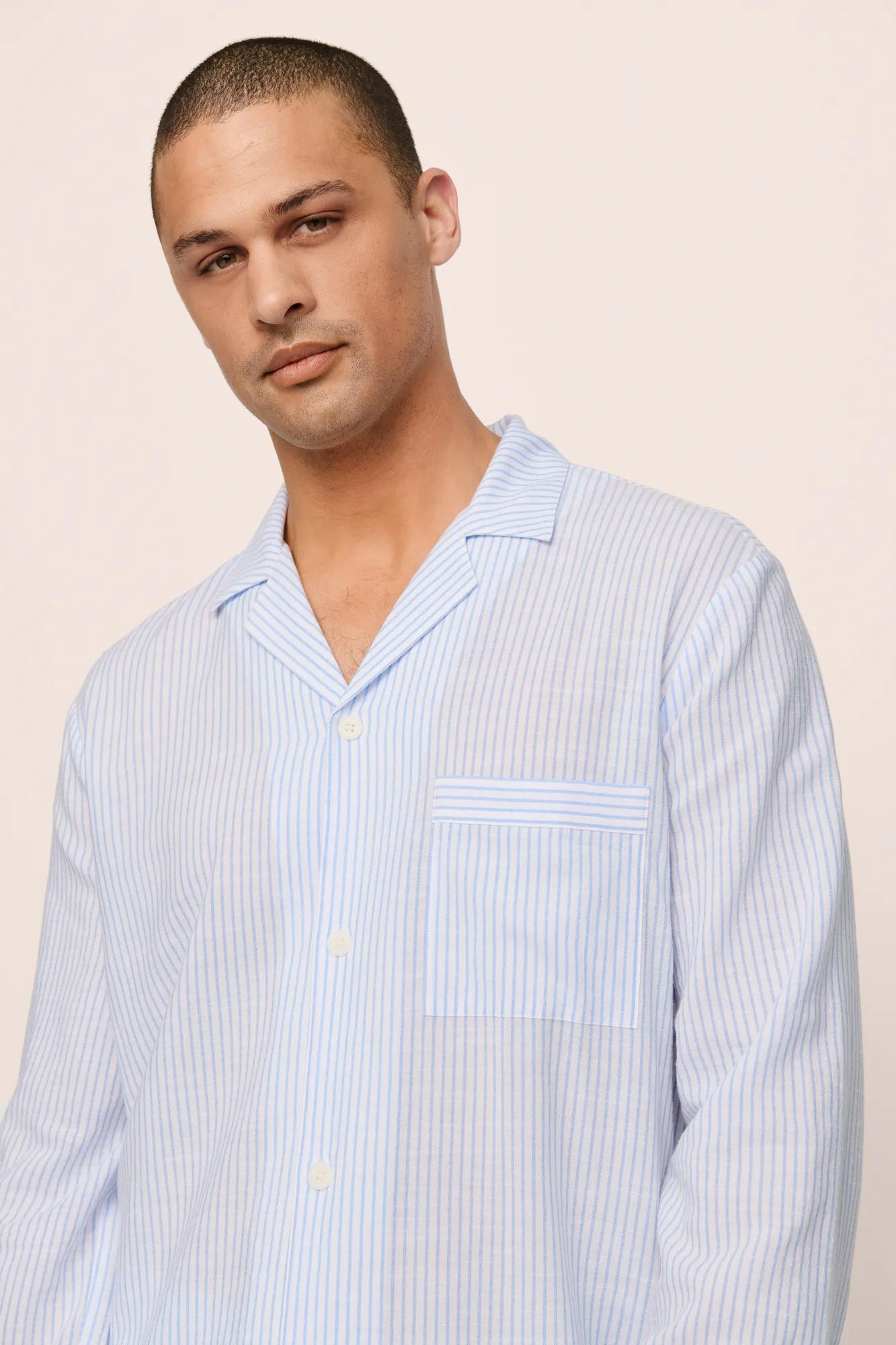 Model is wearing Men's Nautico Long PJ Set in White/CornflowerBlue