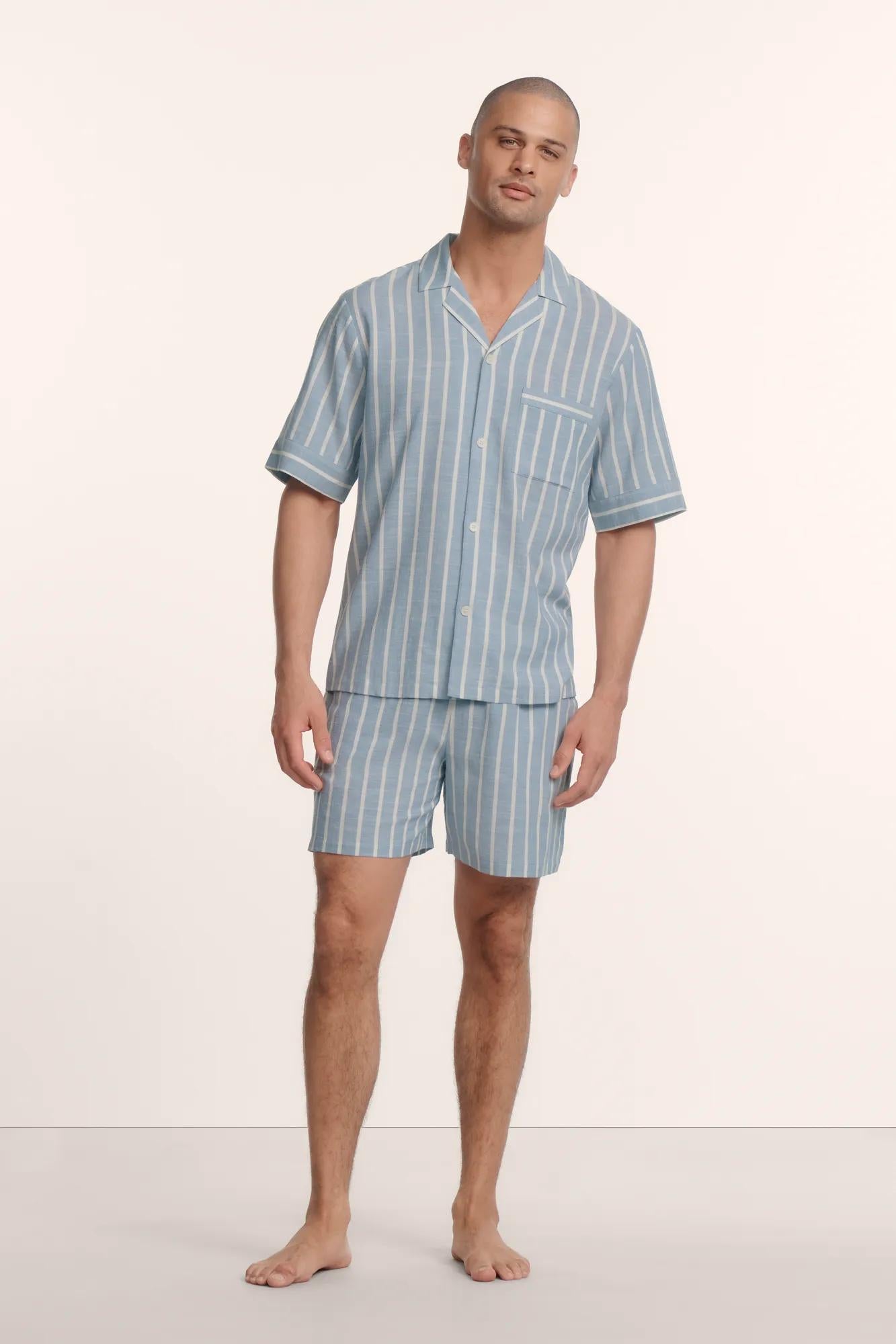 Model is wearing Men's Nautico Short PJ Set in Classic Stripe Slate Blue/Ivor