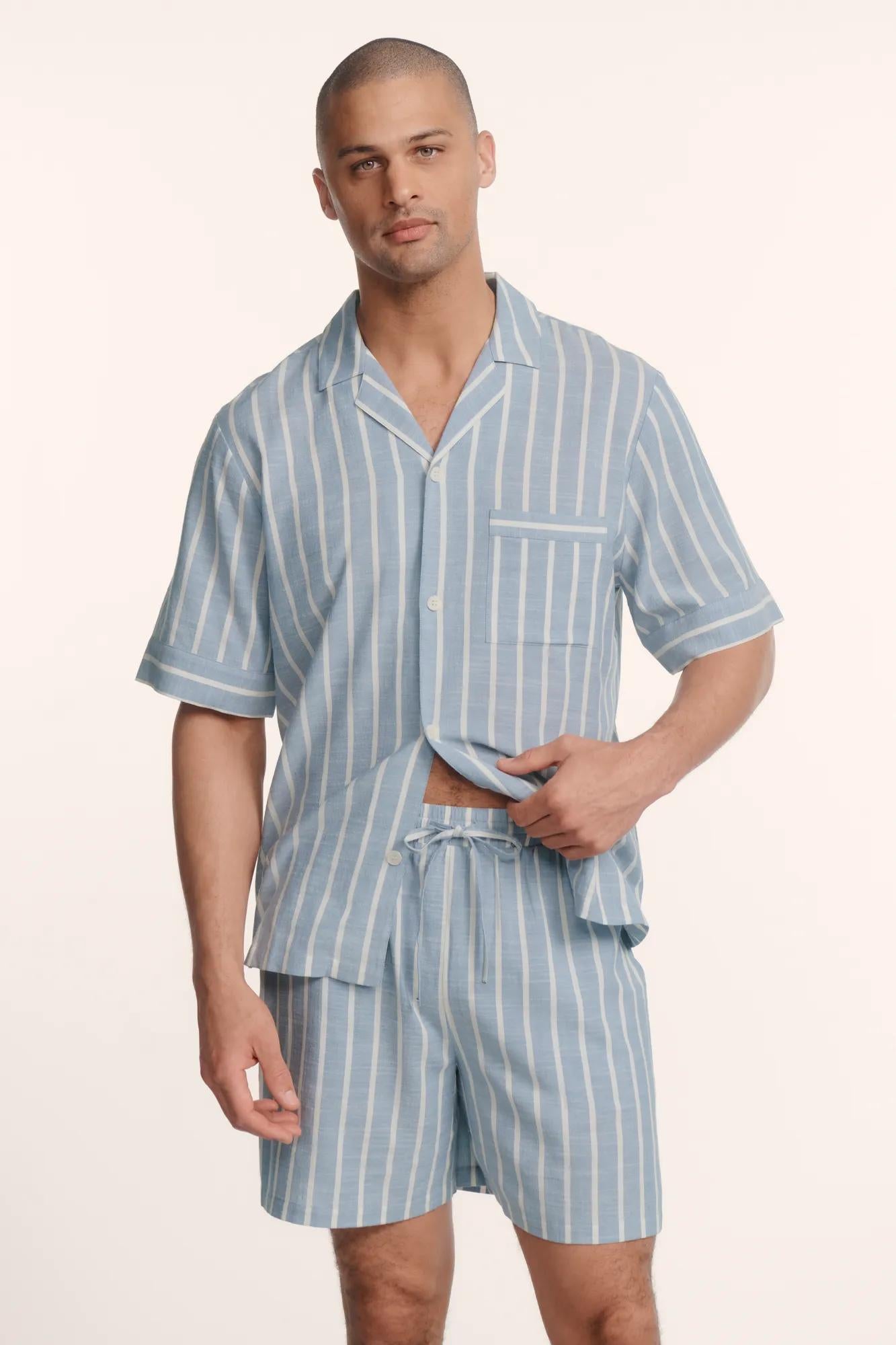 Model is wearing Men's Nautico Short PJ Set in Classic Stripe Slate Blue/Ivor