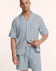 Model is wearing Men's Nautico Short PJ Set in Classic Stripe Slate Blue/Ivor