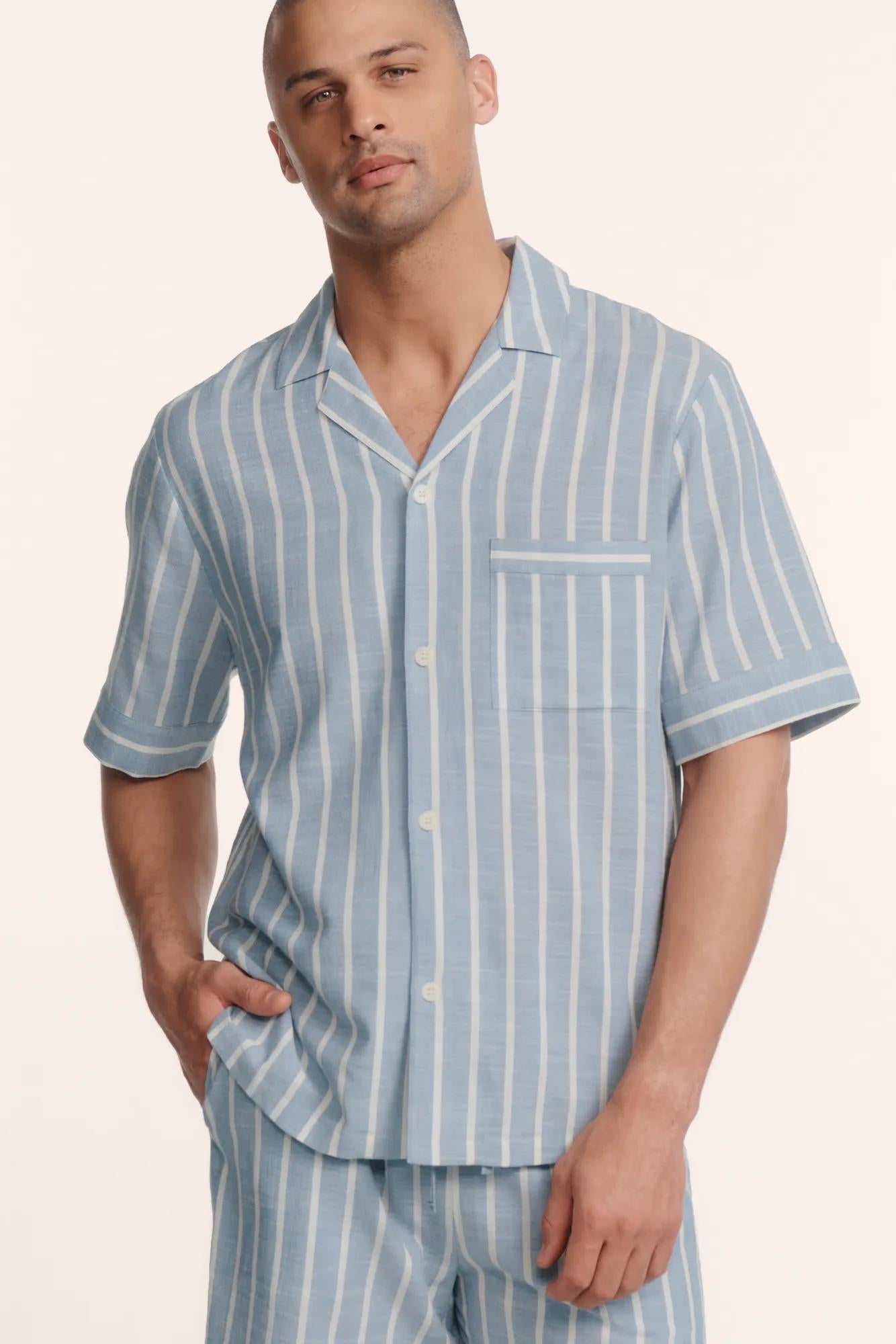 Model is wearing Men's Nautico Short PJ Set in Classic Stripe Slate Blue/Ivor