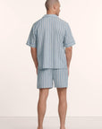 Model is wearing Men's Nautico Short PJ Set in Classic Stripe Slate Blue/Ivor