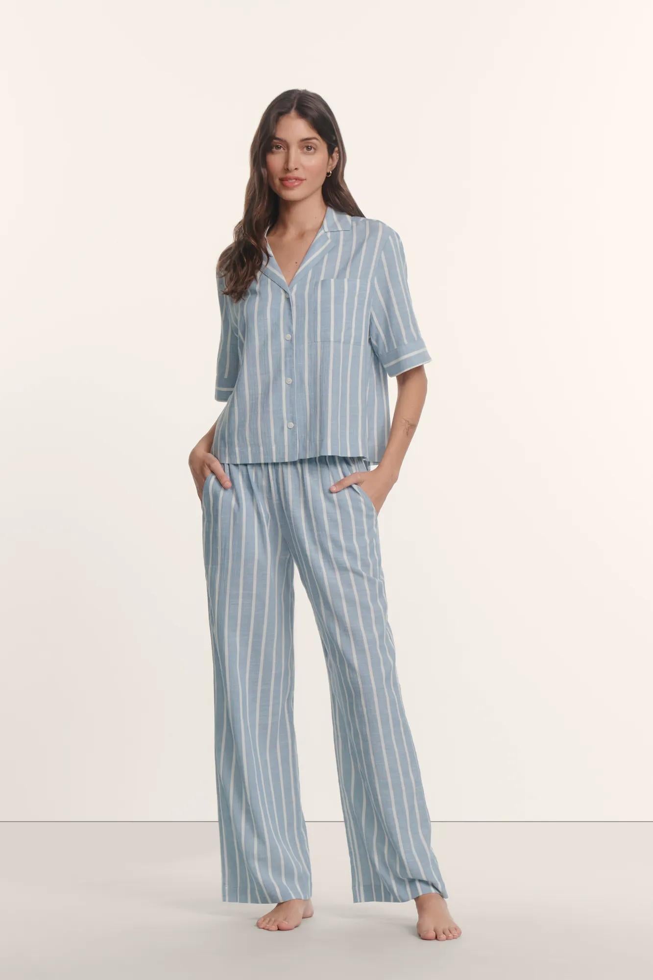 Model is wearing Nautico Relaxed Short Sleeve & Pant PJ Set in Classic Stripe Slate Blue/Ivor