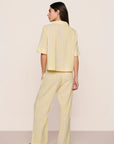 Model is wearing Nautico Relaxed Short Sleeve & Pant PJ Set in Classic Stripe Sunbeam/Ivory