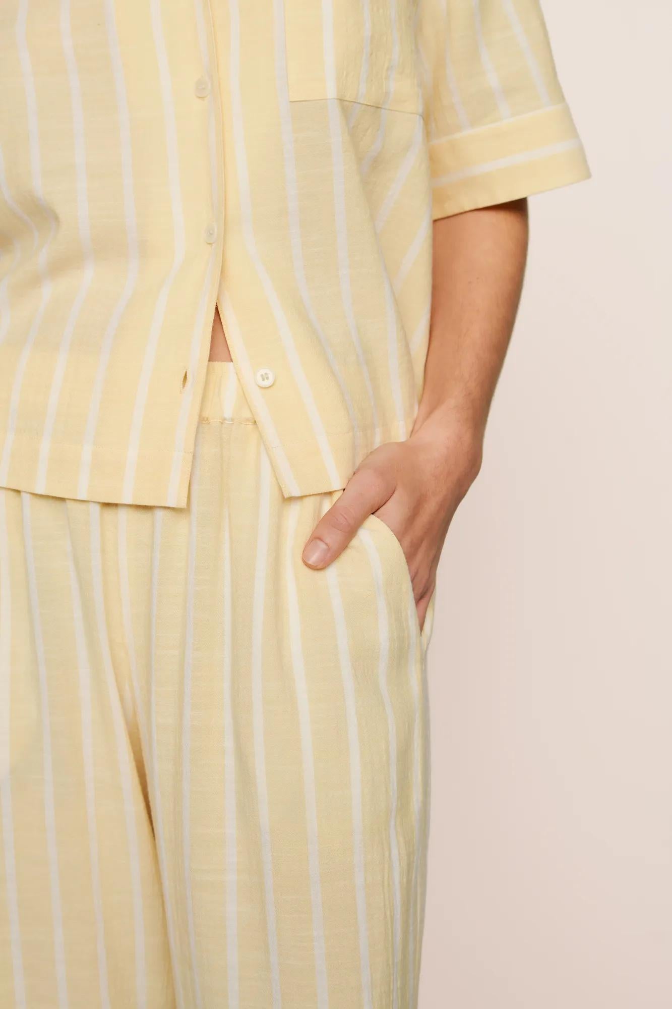Model is wearing Nautico Relaxed Short Sleeve & Pant PJ Set in Classic Stripe Sunbeam/Ivory