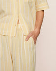 Model is wearing Nautico Relaxed Short Sleeve & Pant PJ Set in Classic Stripe Sunbeam/Ivory