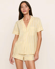 Model is wearing Nautico Shortie Short PJ Set in Classic Stripe Sunbeam/Ivory