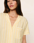 Model is wearing Nautico Shortie Short PJ Set in Classic Stripe Sunbeam/Ivory