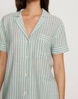 Model is wearing Nautico Shortie Short PJ Set in Regatta Stripe Seagrass/White