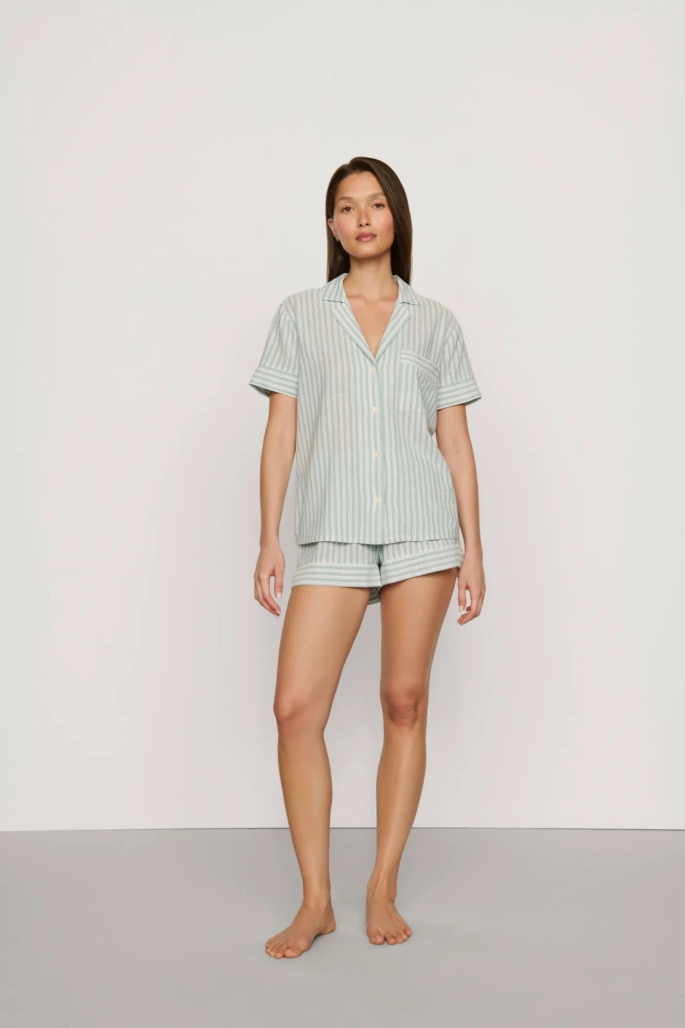 Model is wearing Nautico Shortie Short PJ Set in Regatta Stripe Seagrass/White