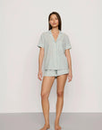 Model is wearing Nautico Shortie Short PJ Set in Regatta Stripe Seagrass/White