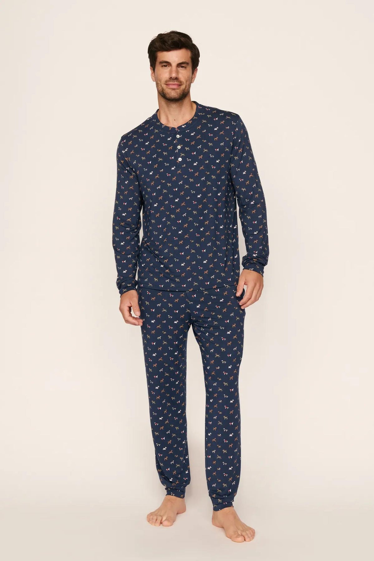 Model is wearing Henry Printed TENCEL™ Modal Long PJ Set in Santa Paws Navy