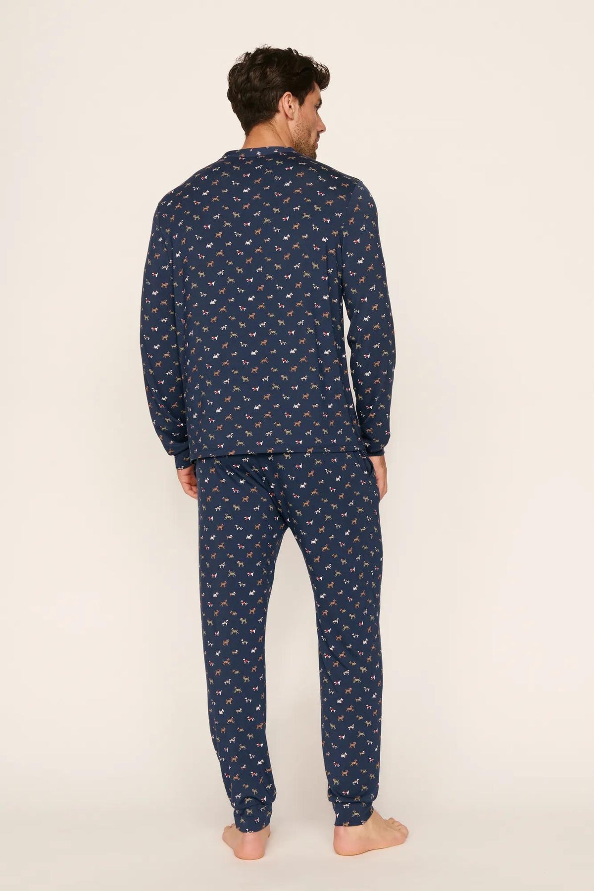 Model is wearing Henry Printed TENCEL™ Modal Long PJ Set in Santa Paws Navy