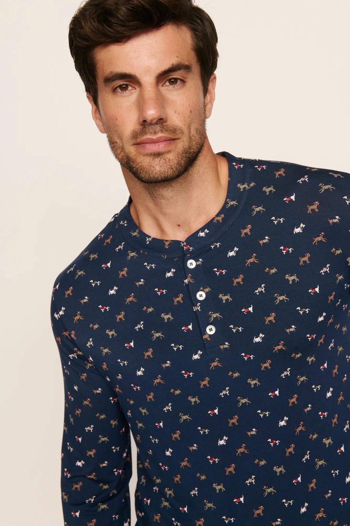 Model is wearing Henry Printed TENCEL™ Modal Long PJ Set in Santa Paws Navy