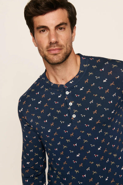 Model is wearing Henry Printed TENCEL™ Modal Long PJ Set in Santa Paws Navy