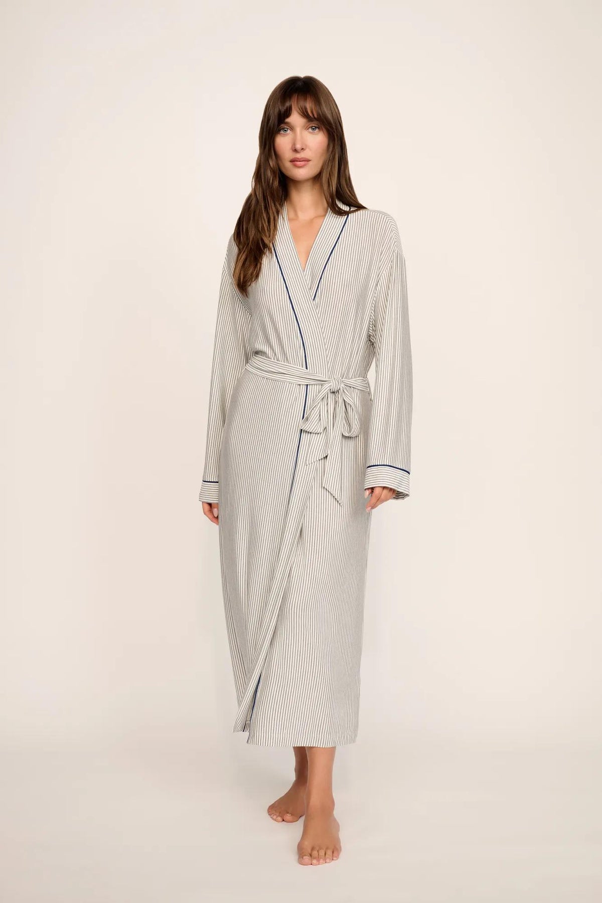 Model is wearing Gisele Printed TENCEL™ Modal Long Robe in Duo Stripe Ivory/Navy