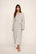Model is wearing Gisele Printed TENCEL™ Modal Long Robe in Duo Stripe Ivory/Navy