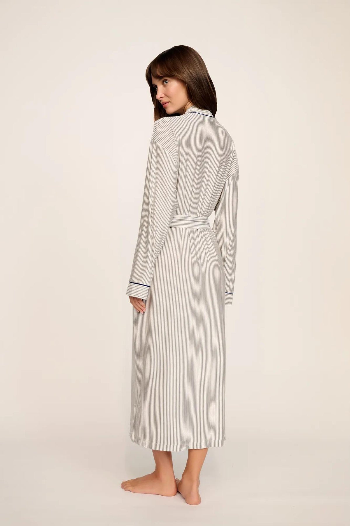 Model is wearing Gisele Printed TENCEL™ Modal Long Robe in Duo Stripe Ivory/Navy