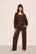 Model is wearing Recycled Sweater Pant  in  Chocolate