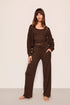 Model is wearing Recycled Sweater Pant  in  Chocolate